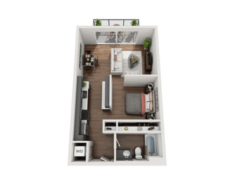 3D floor plan of a studio apartment featuring a kitchen, living area, bedroom, bathroom, washer/dryer, desk, TV, and a balcony with outdoor seating and plants. Wood flooring and modern furnishings throughout.